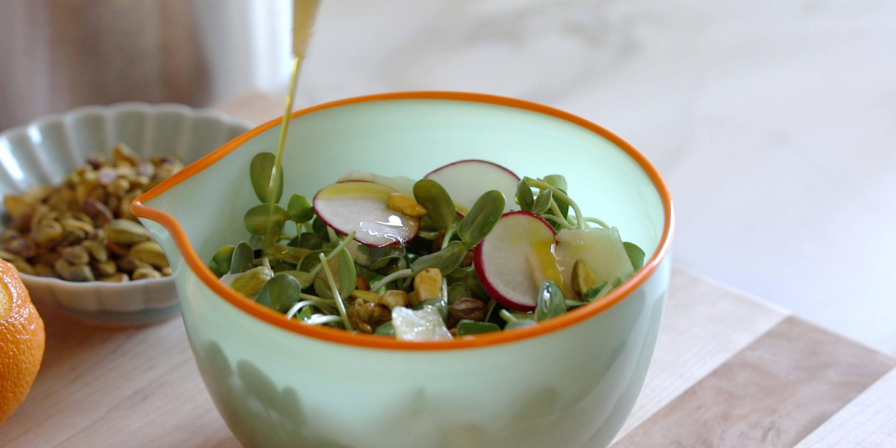 Sunflower microgreen salad in bowl with olive oil