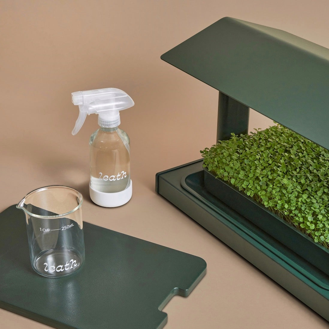 The Fieldhouse comes with a germination lid, watering cup, and spray bottle