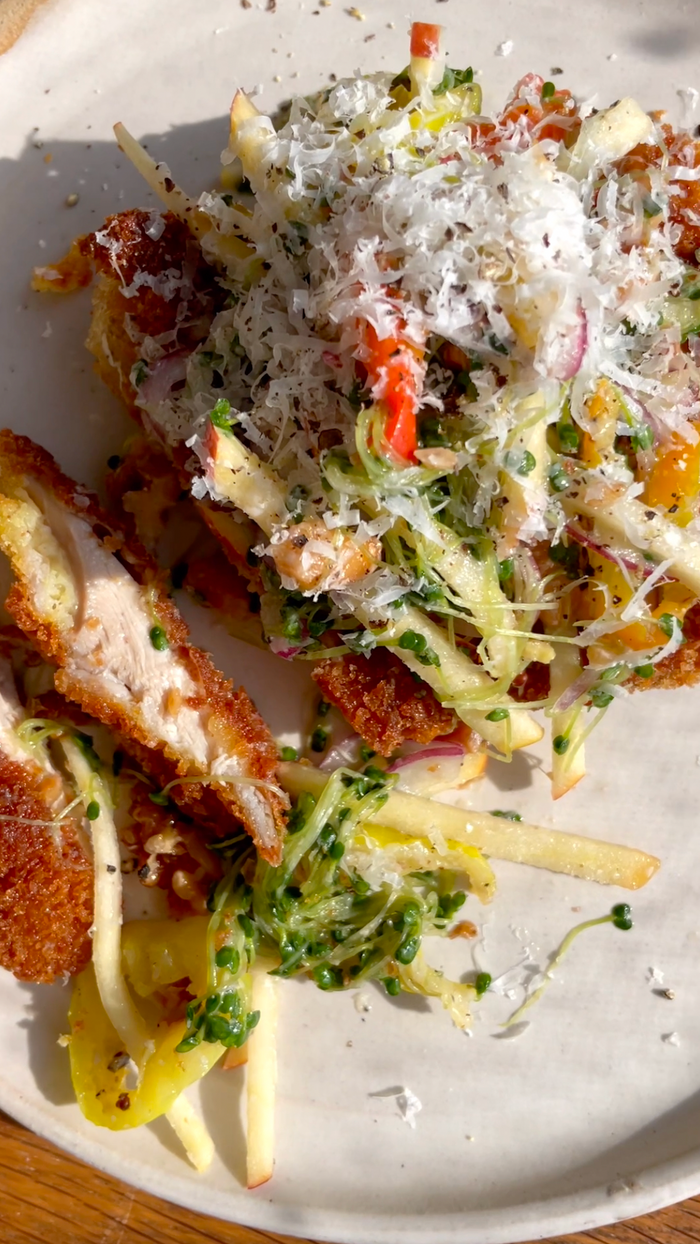 Crispy Chicken Milanese with Broccoli Sprout, Pickled Pepper, Apple, and Toasted Walnut Slaw