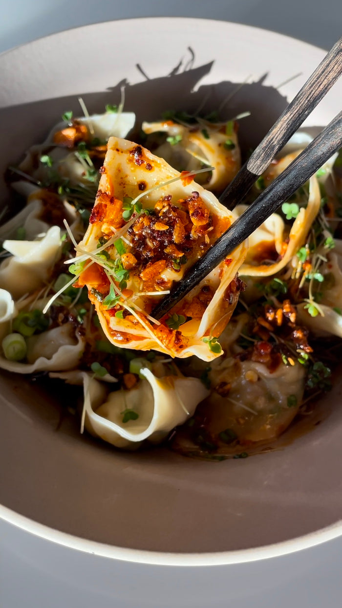 Shrimp Dumplings with Broccoli Microgreens and Chili Oil Dipping Sauce