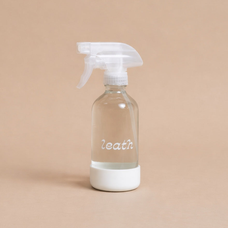 Leath branded glass spray bottle